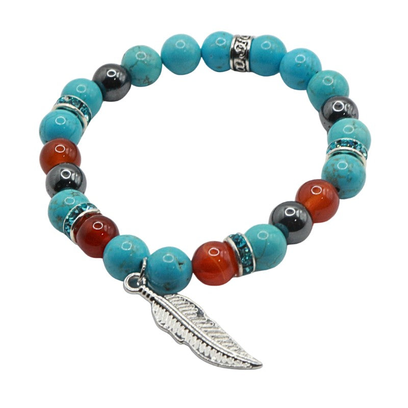 Multicolored beaded bracelet with a feather charm on a white background