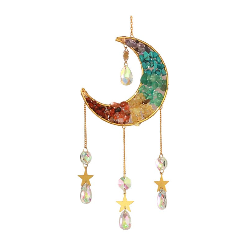 Decorative moon and star hanging with gemstones on a white background