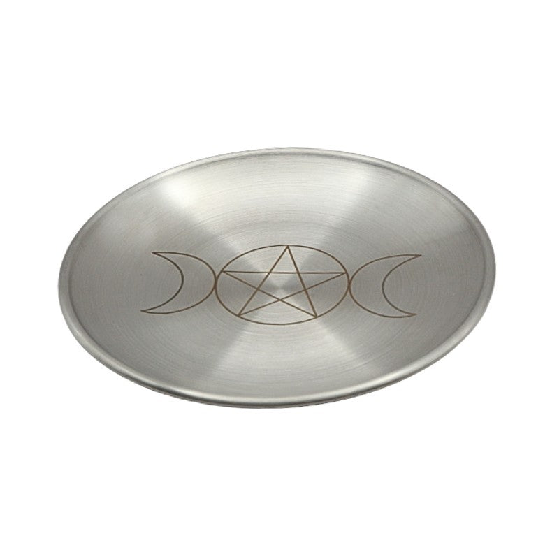 Metallic dish with pentagram and moon phase design on a white background