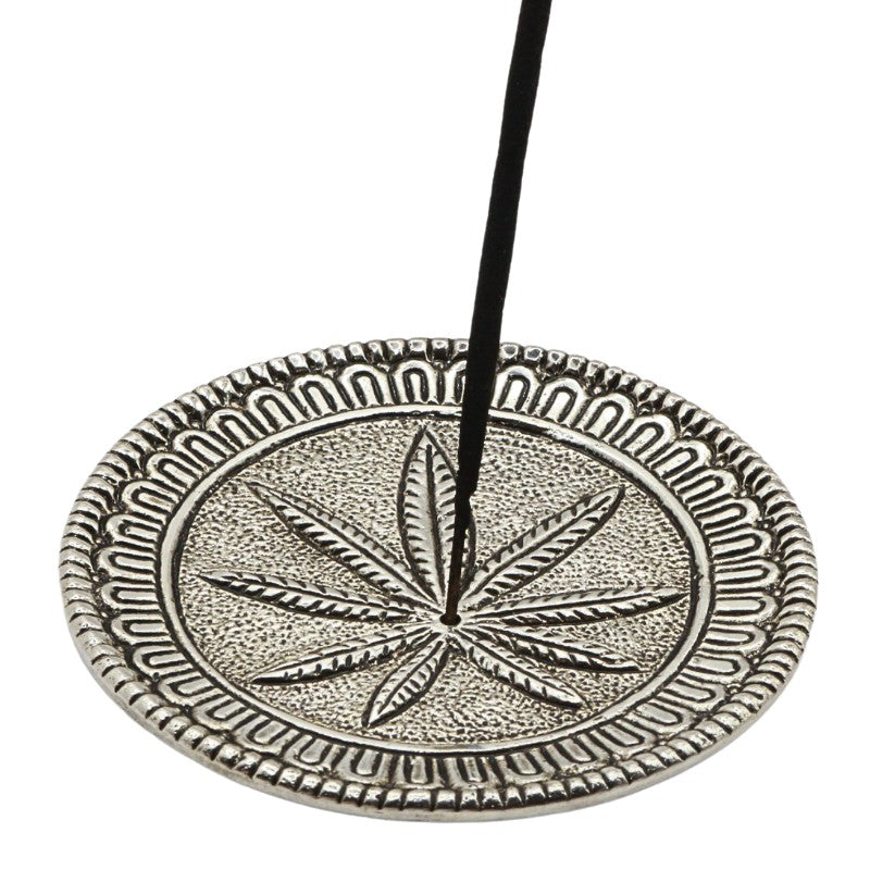 incense stick in an aluminium incense burner with hemp leaf