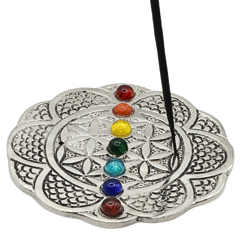 incense stick in an aluminium incense burner with chakra beads
