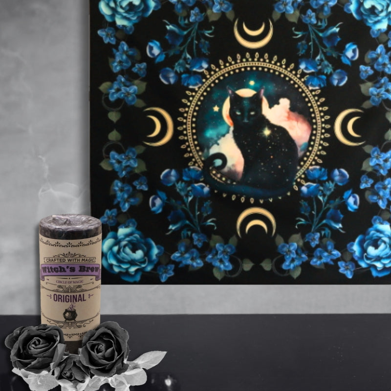 Black Cat Familiar Wall Hanging behind a witches brew candle and black roses