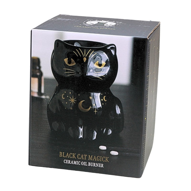 packaging box of a black cat shaped oil burner with gold stars and moons, on a white background