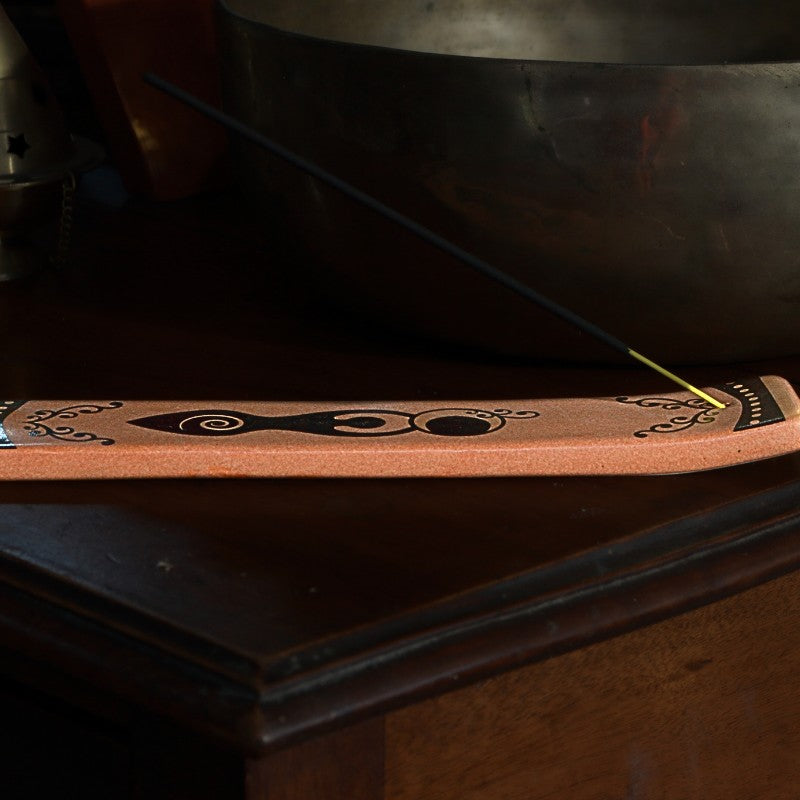 ceramic incense holder with spiral goddess design