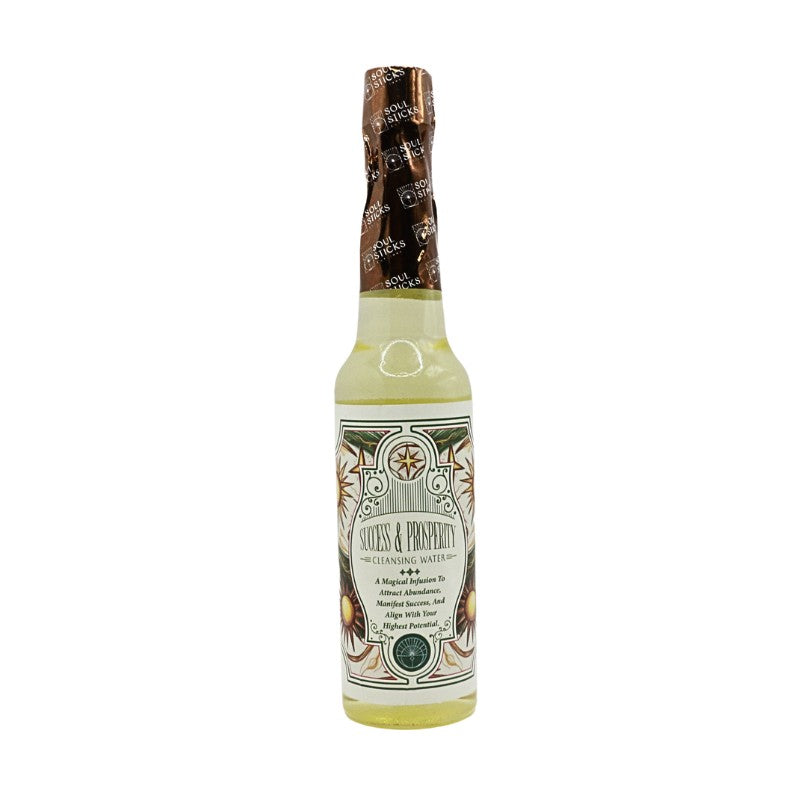 Bottle of Success and prosperity cleansing water with decorative label on a white background
