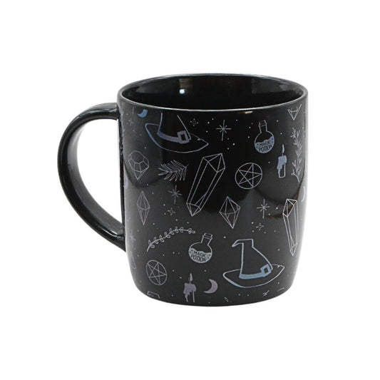 Black mug with witchy illustrations on a white background