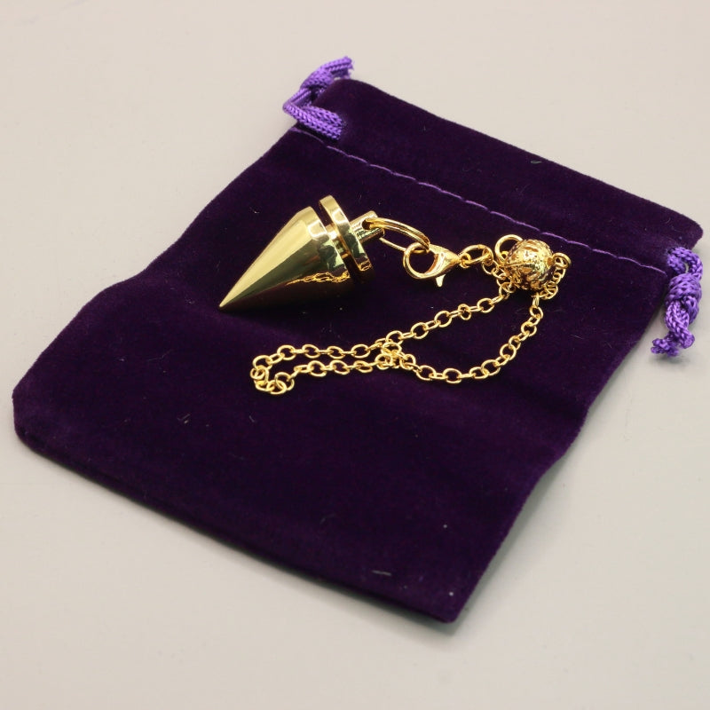 Gold Pendulum on purple bag