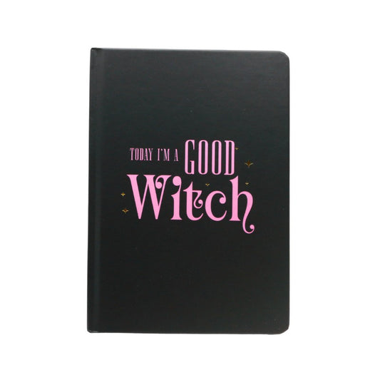 Black notebook with pink text 'Today I'm a Good Witch' on a white background