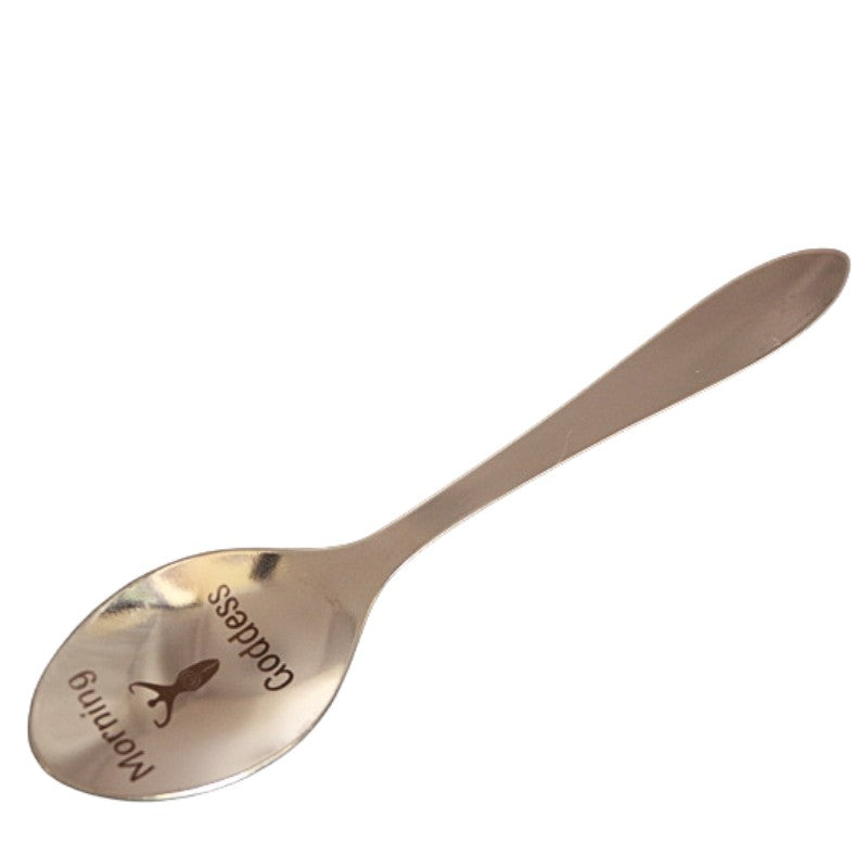 stainless steel teaspoon with "Morning Goddess" and a spiral goddess engraved in the dish