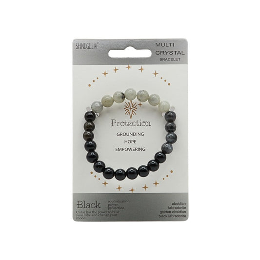 Multi crystal bracelet on card with black and white beads.