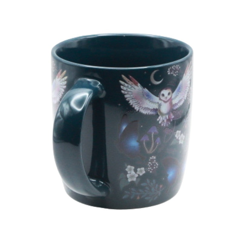 blue mug with owl and floral design on a white background