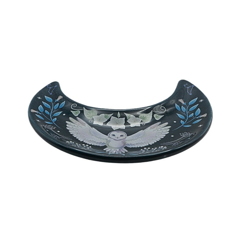Decorative plate with an owl design on a white background