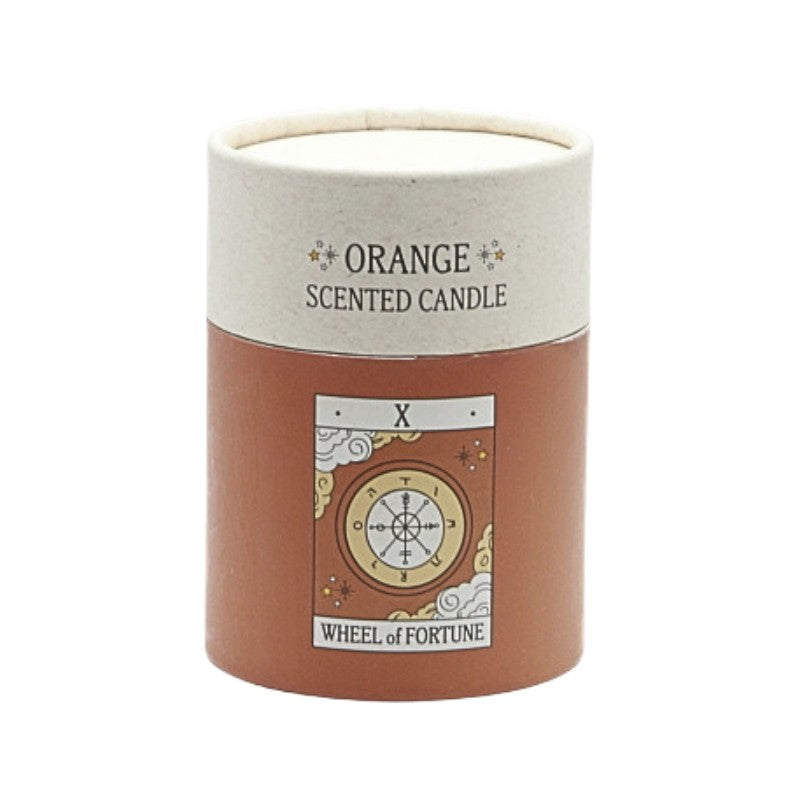 Orange scented candle labeled 'Wheel of Fortune' on a white background
