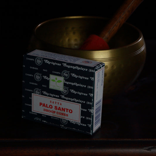 box of satya brand incense cones in front of a brass singing bowl