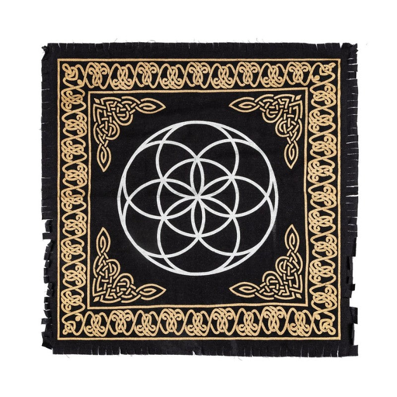 Black altar cloth with gold border and white seed of life geometric design on a white background