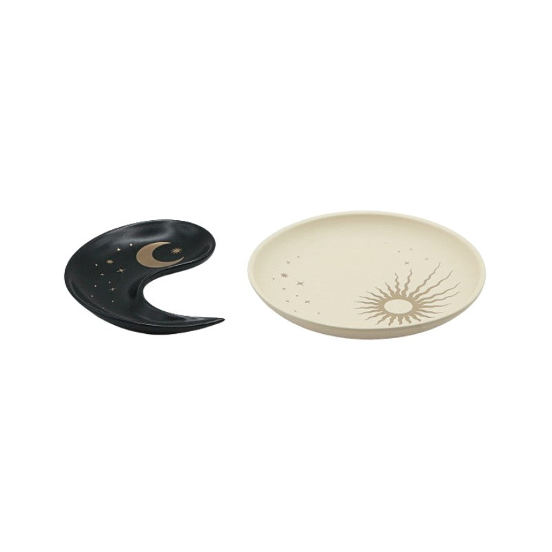 Black and beige ceramic plates on a white background