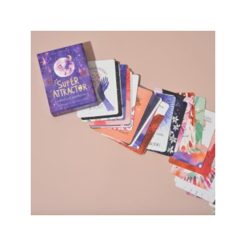 super attractor tarot cards laid out on table with box