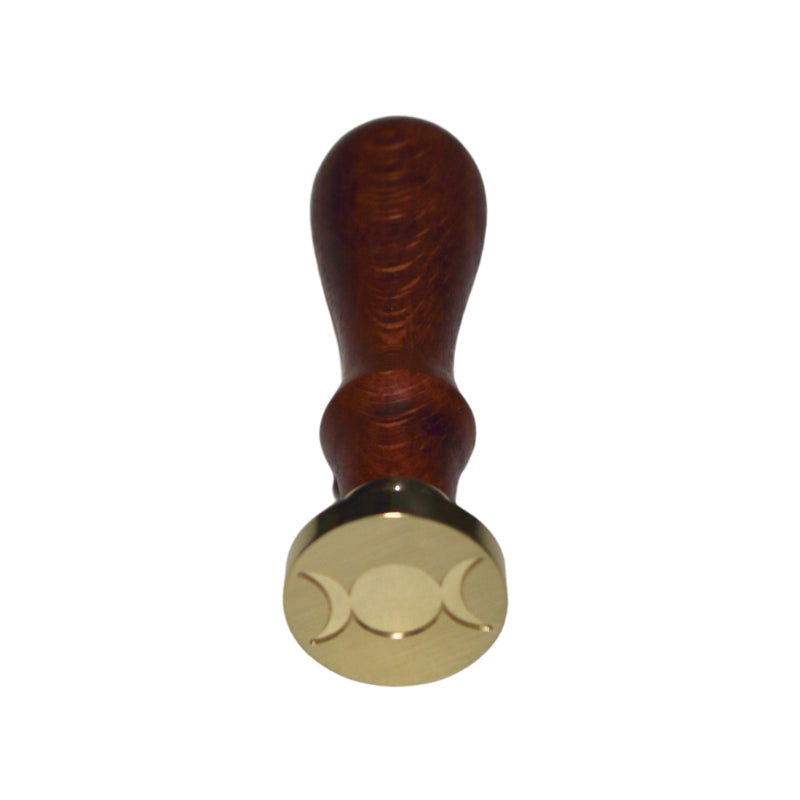 Brass wax seal stamp of a triple moon on a wooden handle