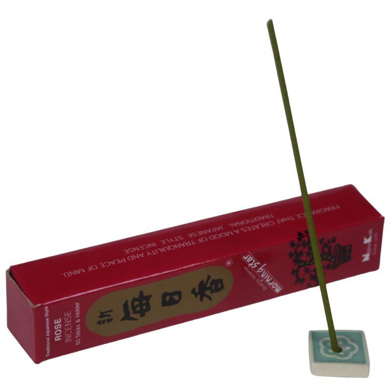 rectangle box of japanese morning star "Rose" incense sticks next to a tile incense holder