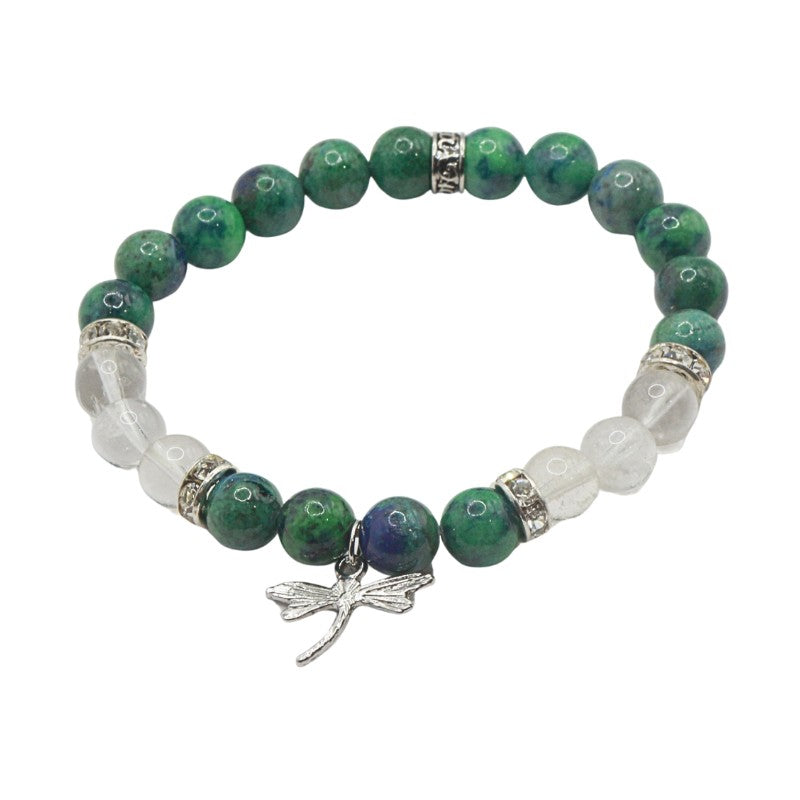 Bracelet with green and white beads and a silver dragonfly charm on a white background