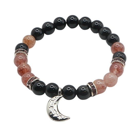 Beaded bracelet with black and pink beads and a silver moon charm on a white background