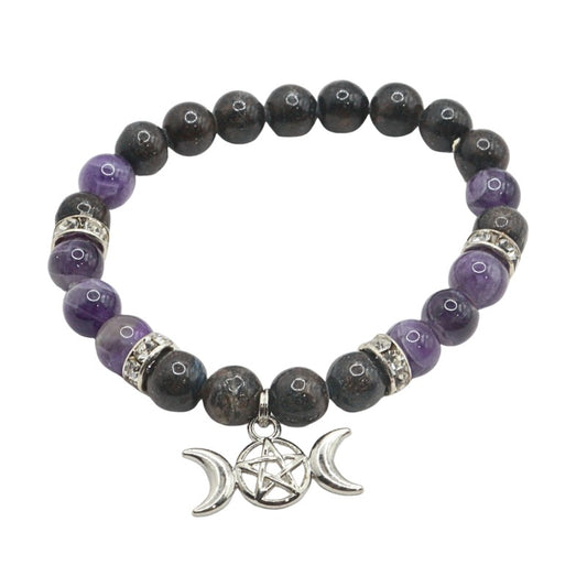 Beaded bracelet with purple and black stones and a silver pentacle charm on a white background