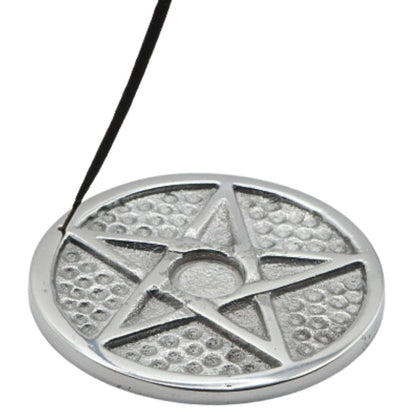 stick of incense in an aluminium pentacle incense holder