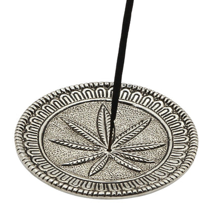 incense stick in an  aluminium incense burner with hemp leaf 