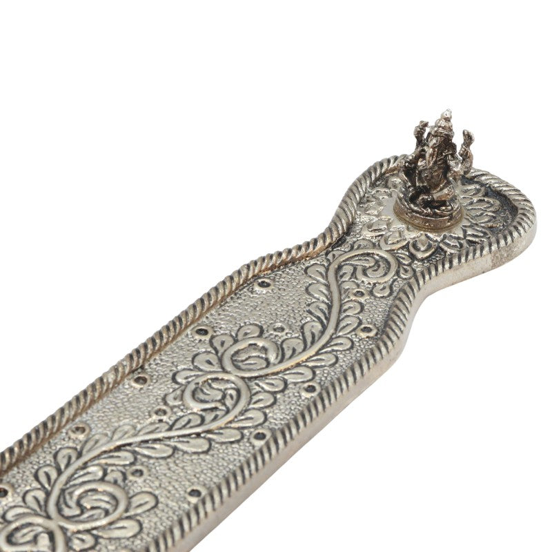 incense stick in an  aluminium incense burner
