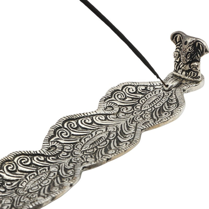  aluminium incense burner with ganesh and an incense stick