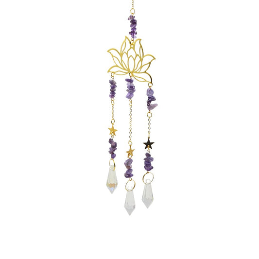 Decorative hanging ornament with lotus flower design, beads, and crystals on a white background