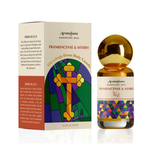 Bottle of anointing oil with colourful label next to packaging box
