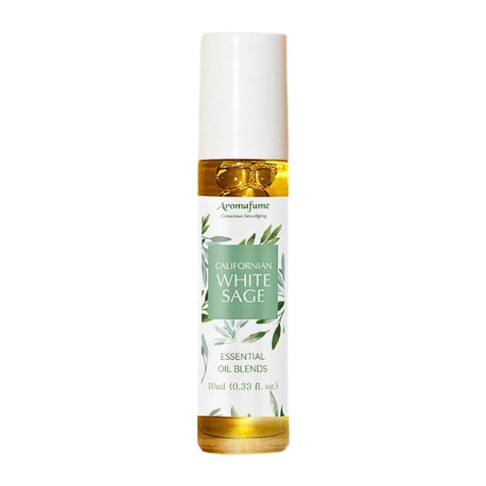 glass bottle containing oil with a white and green floral  label