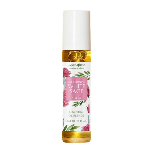 glass bottle containing oil with a white, pink and green floral  label
