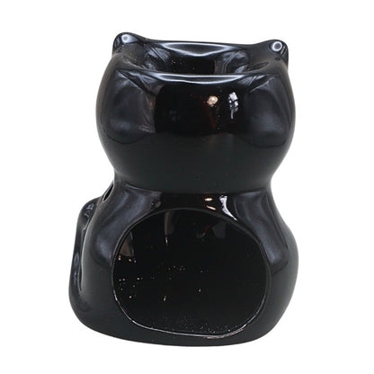 black cat shaped oil burner on a white background