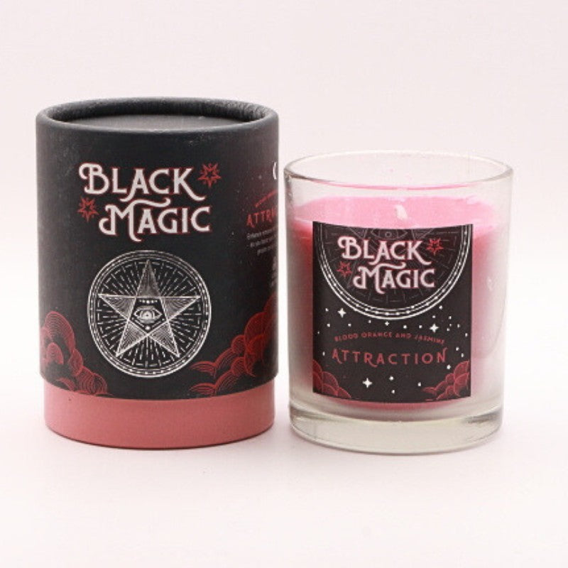 gift box next to a red attraction candle in a glass jar 