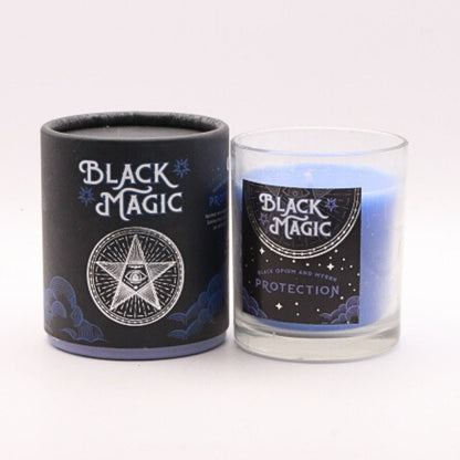 gift box next to a blue protection candle in a glass jar 