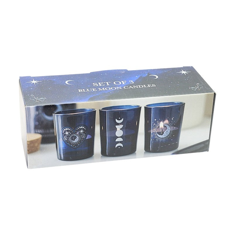Set of three blue moon candles in packaging with celestial design