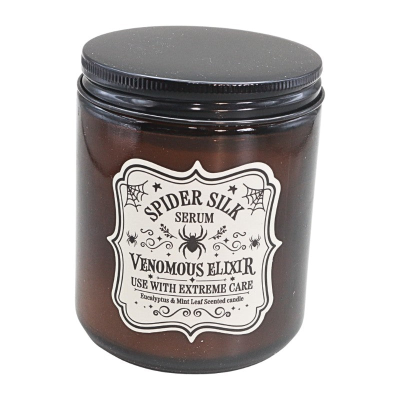 amber coloured jar with white label and spider on front next with a black lid