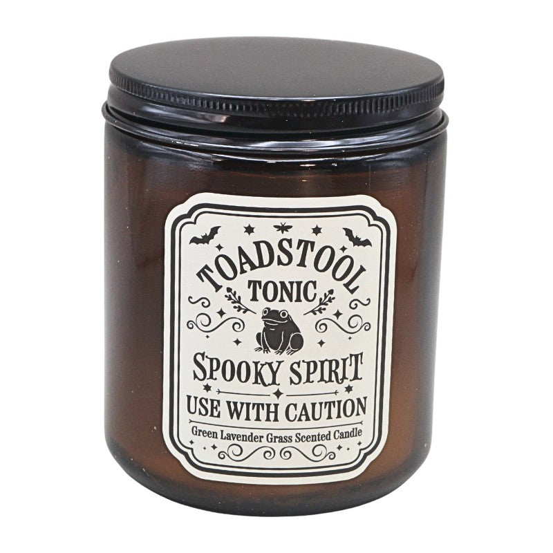 amber coloured glass jar with black lid and white label showing a frog and titled "toadstool tonic"