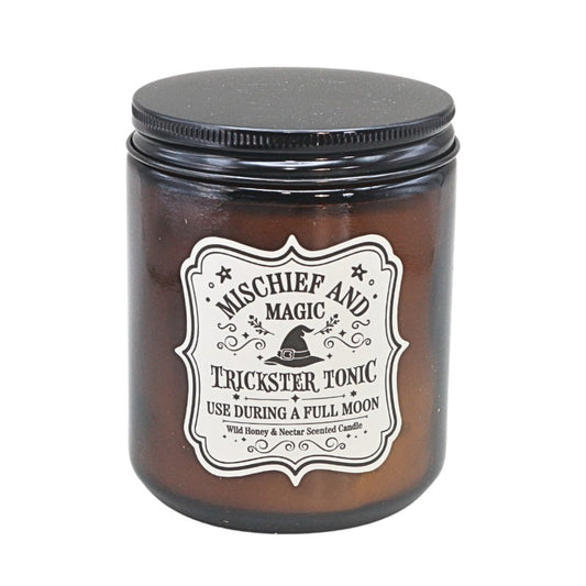 Brown Amber Glass jar with a black lid,  white label  and a witches hat design