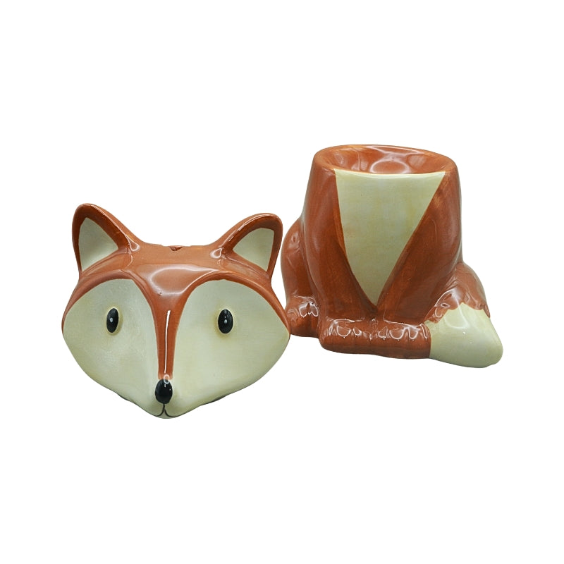 Ceramic fox oil burner with the fox-head lid removed, revealing the bowl for oil or wax melts.