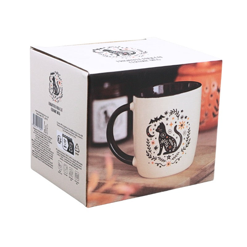 packaging box featuring cream cup with black handle with an image of a black cat and black and orange floral design on a white background