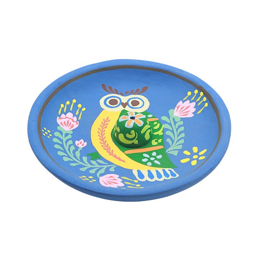 Round blue incense plate with a colorful owl design on a white background