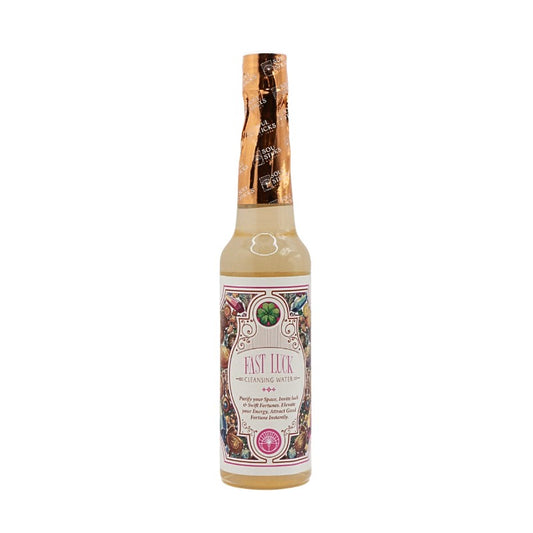 Bottle of Fast Luck cleansing water on a white background