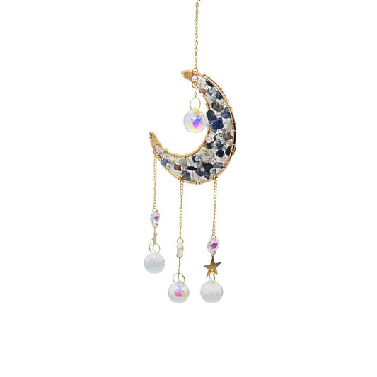 Decorative hanging moon and star ornament with gemstones on a white background