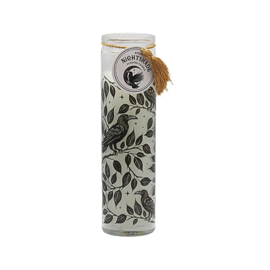 Candle with bird and leaf design on a white background