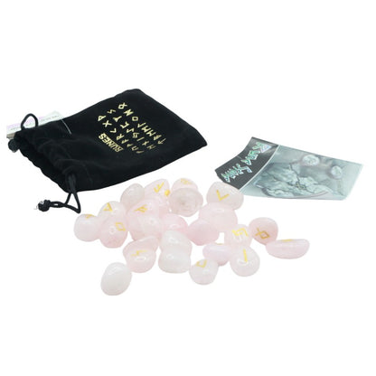 Black velvet bag with gold runic alphabet on front next to a set of rose quartz  runes and a rune guide booklet