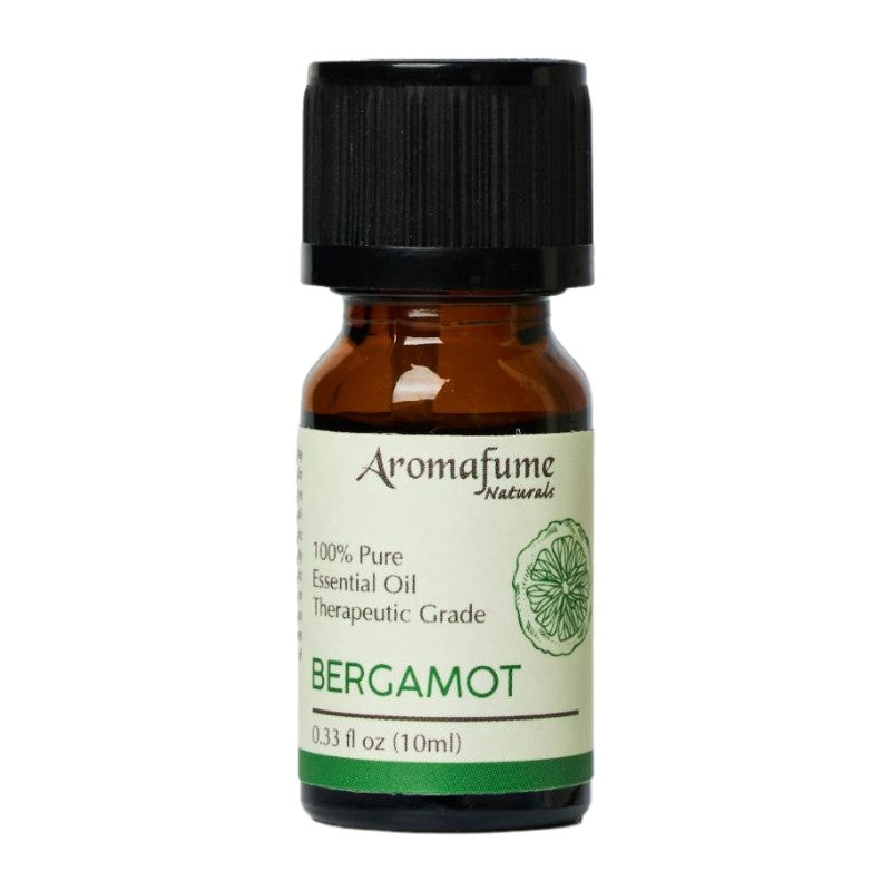 A small amber glass bottle of Bergamot essential oil with a black ribbed cap and a cream label featuring green text and a citrus slice illustration. The brand Aromafume Naturals is visible on the label.
