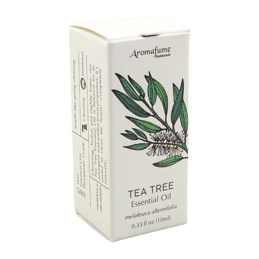 A box of Aromafume Naturals Tea Tree Essential Oil, featuring a white packaging design with a green tea tree illustration and black text.